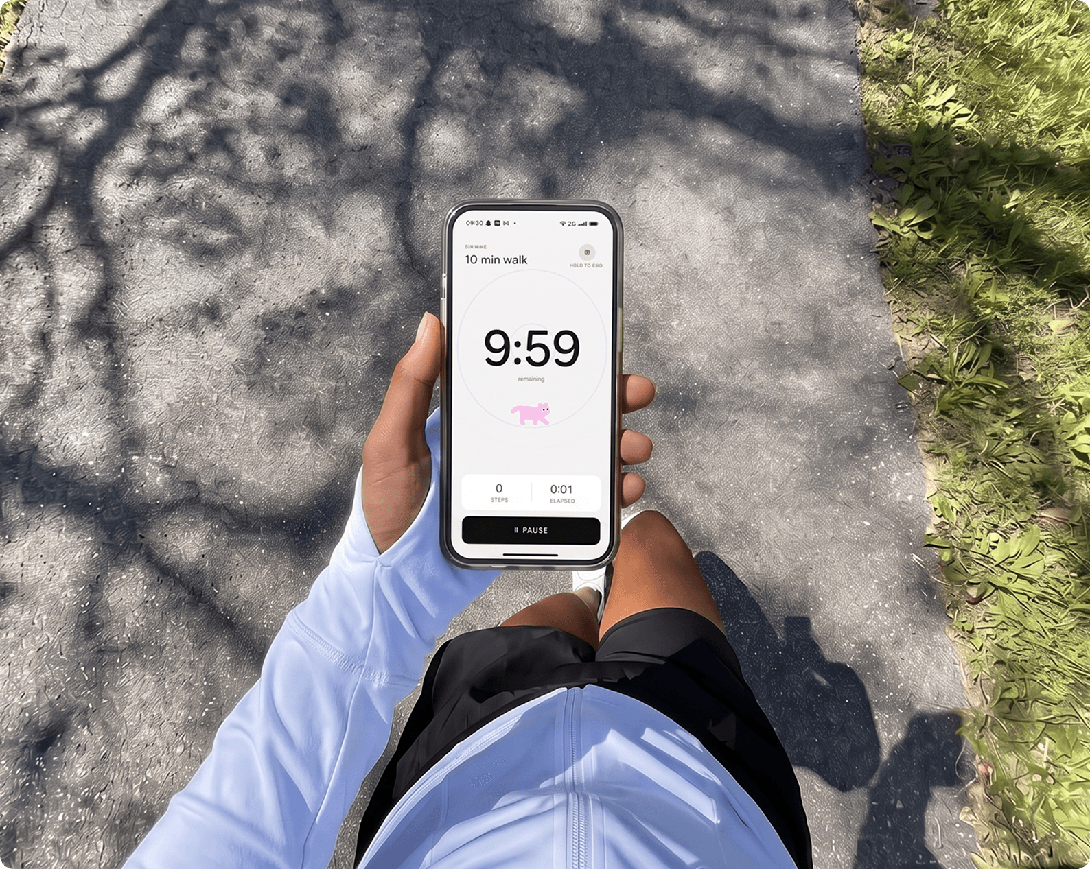 A first-person view of a run in progress, phone in hand showing a 10-minute walk countdown